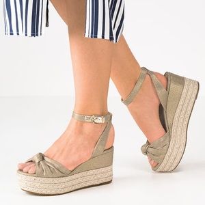 Michael Kors maxwell metallic gold wedge sandal.